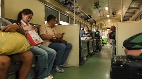 Passengers Commuting on a Traditional Thai Train in Bangkok Video stock 327688677