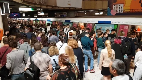 Passengers crowd to get in and out a subway train Stock Footage 89394150