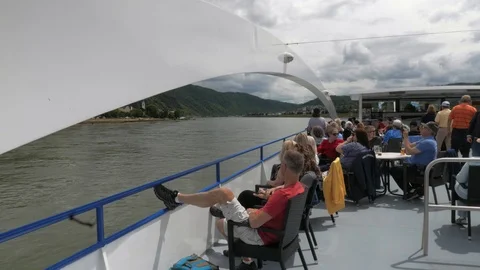 Passengers on the deck of a river cruise contemplating the landscape on the Stock Footage 111133850