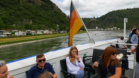 Passengers on the deck of a river cruise contemplating the landscape on the Stock Footage 111133991