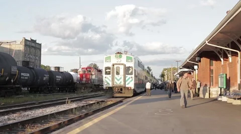 Passengers Depart from Go Train, Train Leaves Station Stock Footage 58112364