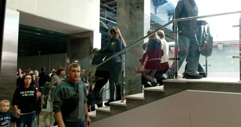 Passengers descend the stairs to the platform, the train doors closed Stock Footage 67468546