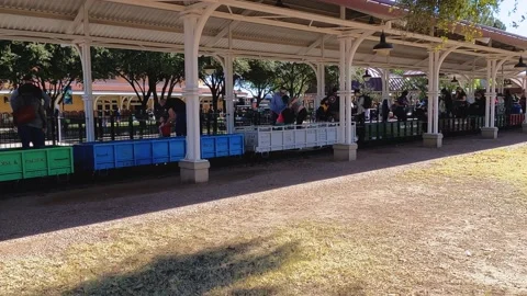 Passengers disembark from the passenger train that circles the Video stock 150528535