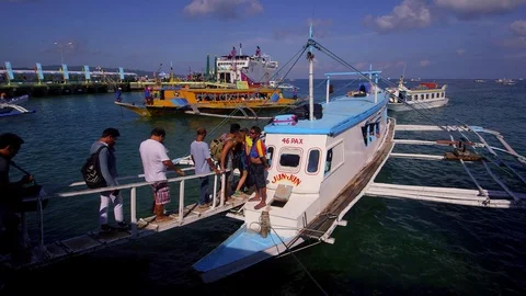 PASSENGERS EMBARK FERRY BORACAY PORT PHILIPPINES Stock Footage 76834069