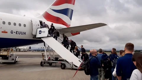 Passengers embarking on BA A320 Stock Footage 246325377