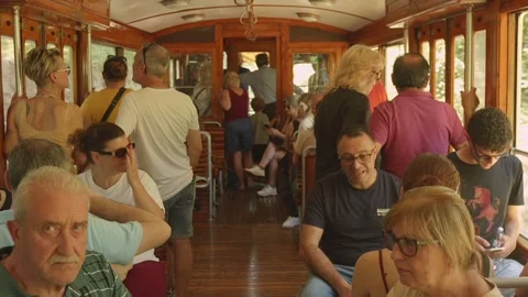 Passengers enjoying a journey in classic Sassi Superga tram, Turin, Italy Stock Footage 345286387