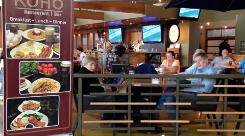 Passengers enjoying meal at Koho restaurant Stock Footage 51715327