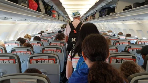 Passengers enter an airplane before seating Stock Footage 114114146