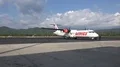 Passengers enter airplanes at airfield Komodo Airport LBJ 4k or 4k+ Resolution
