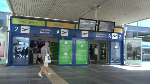 Passengers enter and exit the departures at the Athens Airport 스톡 동영상 142837378