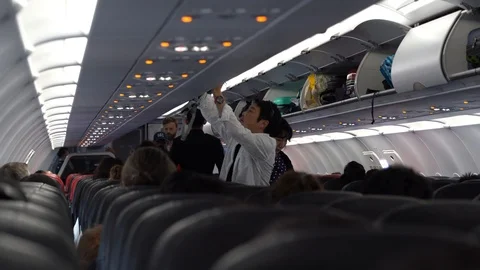 Passengers enter the cabin for boarding. Plane flew Singapore to Kuala Lumpur Stock Footage 113919314