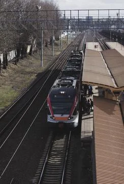 Passengers enter in modern train Stock Photos