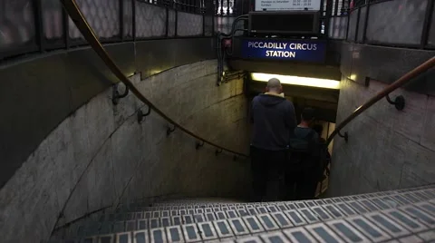 Passengers enter the Piccadilly Circus underground station entrance in London 스톡 동영상 65214425