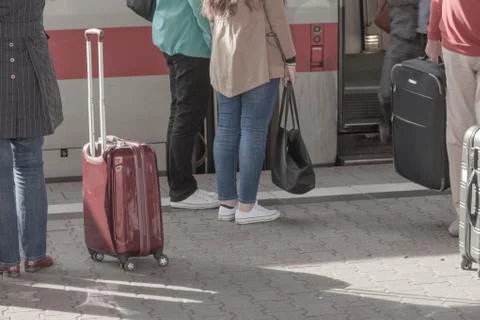 Passengers enter train waiting ready in station Stock Photos