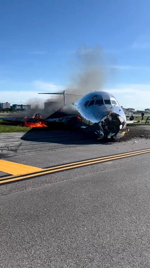 Passengers Evacuate Red Air Flight After Plane Catches Fire on Runway, Miami Int Stock Footage 205430656