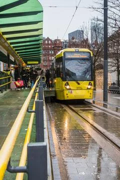 Passengers exit a tram in Manchester Stock Photos