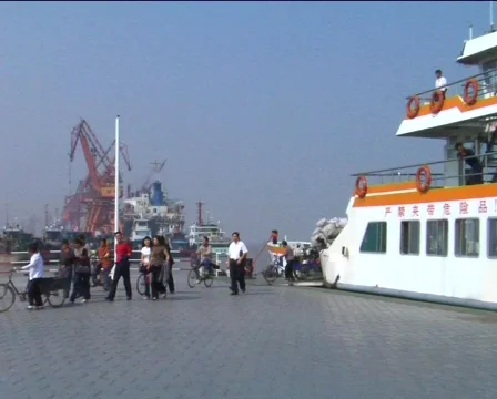 Passengers exiting ferry in China Stock Footage 278012
