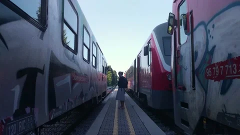 Passengers with face masks waiting on a train in the train station Stock Footage