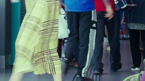 Passengers Feet Walking in Train Station Pulling Luggage Stock Footage 337725810