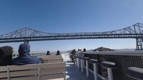Passengers on ferry deck passing beneath Richmond San Rafael Bridge Stock Footage 340292832
