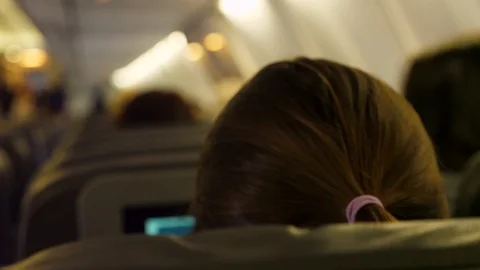 Passengers flying on a crowded airplane while travelling Stock Footage 86222215