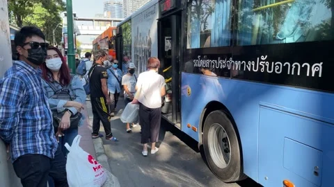 Passengers get on the bus at Chatuchak Park Bus Stop - Point of view shot - Day Stock Footage 176838536