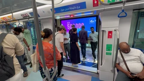 Passengers get off a subway train in Dubai. Dubai UAE 30 August 2026 Stock Footage 344874596