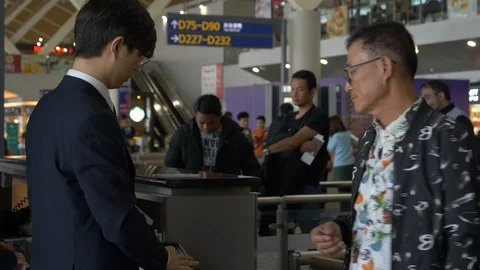 Passengers Get Tickets Checked at Boarding at Shanghai Pudong Airport Stock Footage 122989940