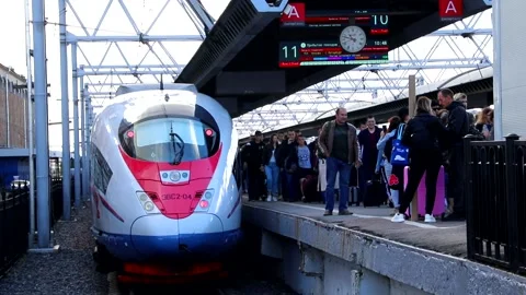 Passengers get off the train. Passengers get out of the peregrine Falcon Stock Footage 143089773