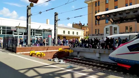 Passengers get off the train. Passengers get out of the peregrine Falcon Video stock 150365516