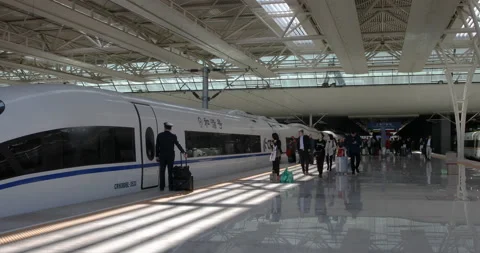 Passengers getting off and on a High-speed CRH bullet train Stock Footage 122118324