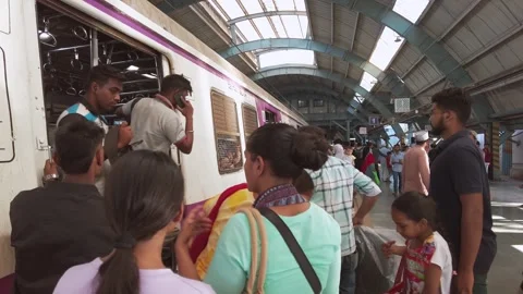 Passengers getting off and on the local train at Andheri Railway Station Stock Footage 289286535