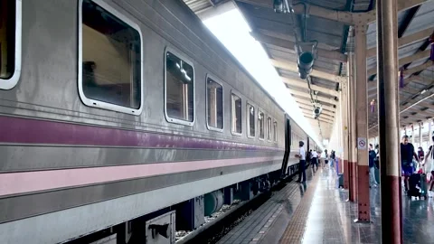 Passengers getting off and waiting on the platform of a Thai sleeper train at Stock Footage 321211547