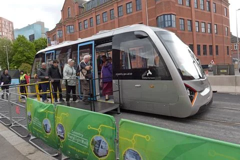 Passengers getting on the Coventry VLR Very Light Rail test tram Stock Photos