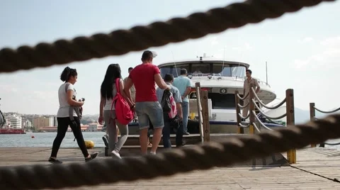 Passengers getting in to ferry at Pasaport ferry station to go Karsiyaka station Stock Footage 55848801