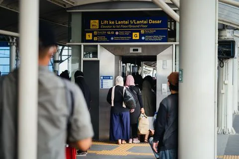 Passengers getting ready to enter the elevator at manggarai station Stock Photos