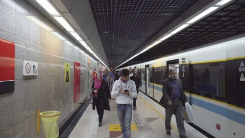 Passengers getting off subway train at Tajrish metro station, Tehran Stock Footage 99525309