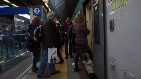 Passengers getting on off a train Stock Footage 121372075