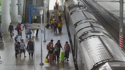 Passengers getting on the train at the railway station, Malaysia Stock Footage 134740071