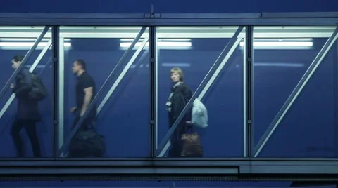 Passengers in a Glass Corridor Time Lapse HD Stock Footage 41573056