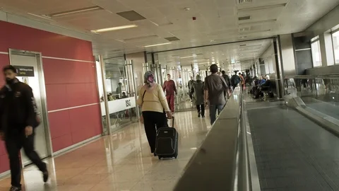 Passengers going to Gate at Airport using an Automatic Track Stock Footage 89607612