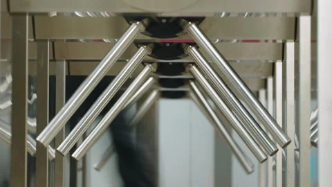 Passengers going through turnstile entry security tourniquet subway platform Stock Footage 273339678