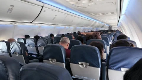 Passengers inside a Boeing jet cabin experiencing light turbulence. Stock Footage 336931558