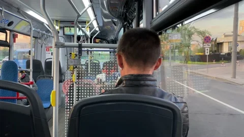 Passengers inside public transport. Bus turn on crossroads. Traffic. Сars drive Stock Footage 196202681