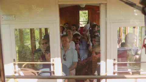 Passengers Inside Sassi Superga Historic Tramway Carriage in Turin, Italy on Stock Footage 342856009