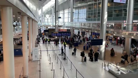 Passengers inside the terminal at Kastrup airport in Copenhagen, Denmark Stock Footage 183269037