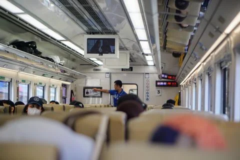 Passengers inside a train car during a journey in Bandung, West Java, Indonesia 写真素材