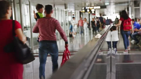Passengers with kids moving between gates inside Istambul Gokcen Int. Airport Stock Footage 68986966
