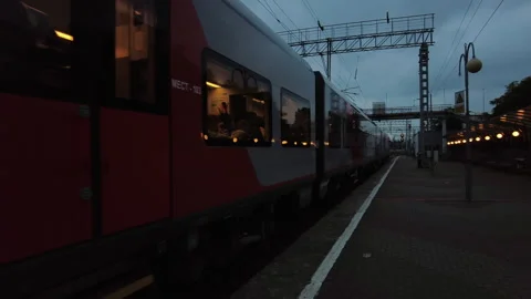Passengers leave on a high-speed train early in the morning to another city. Video stock 249844618
