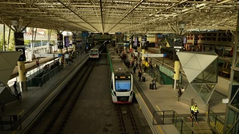 Passengers leave Perth train station in Western Australia tracking shot 6K Video stock 311987370